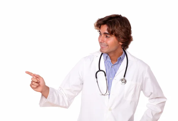 Handsome medical doctor pointing to his right — Stock Photo, Image