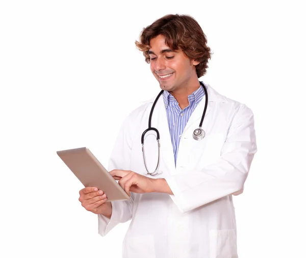 Medical guy smiling while working on his tablet pc — Stock Photo, Image