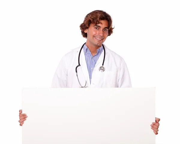 Guapo médico sonriente con pancarta en blanco —  Fotos de Stock