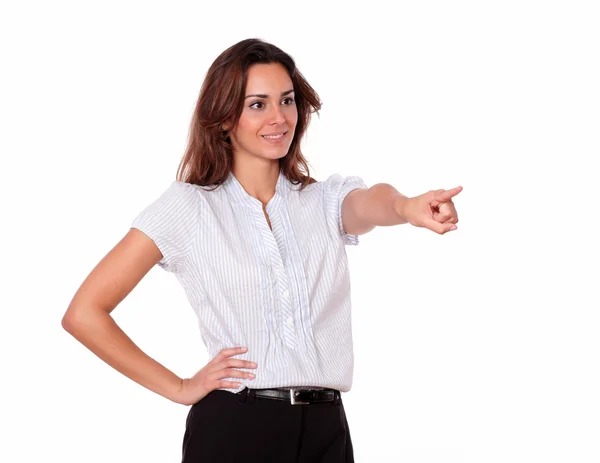 Beautiful young lady standing and pointing — Stock Photo, Image