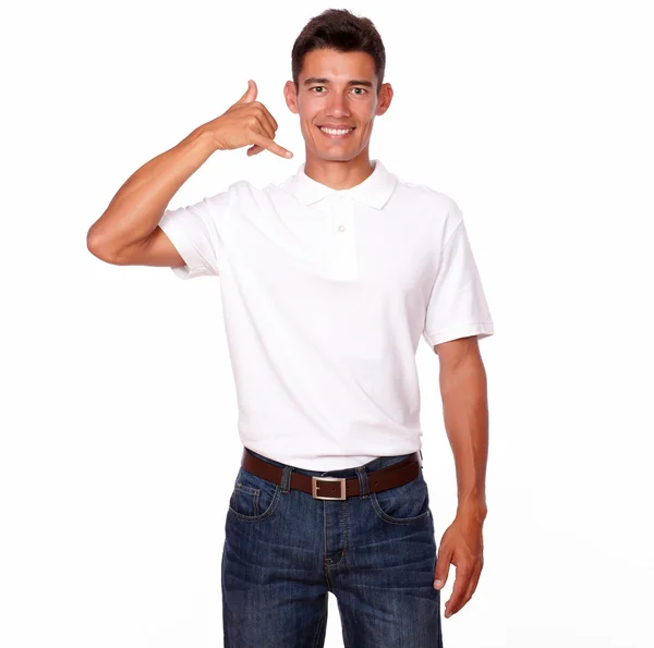 Young man standing and smiling with a call sign. — Stock Photo, Image