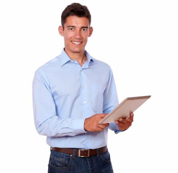 Charming man standing and using his tablet pc — Stock Photo, Image