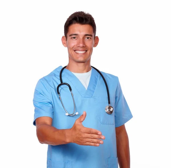 Attractive nurse gesturing a greeting with hand — Stock Photo, Image