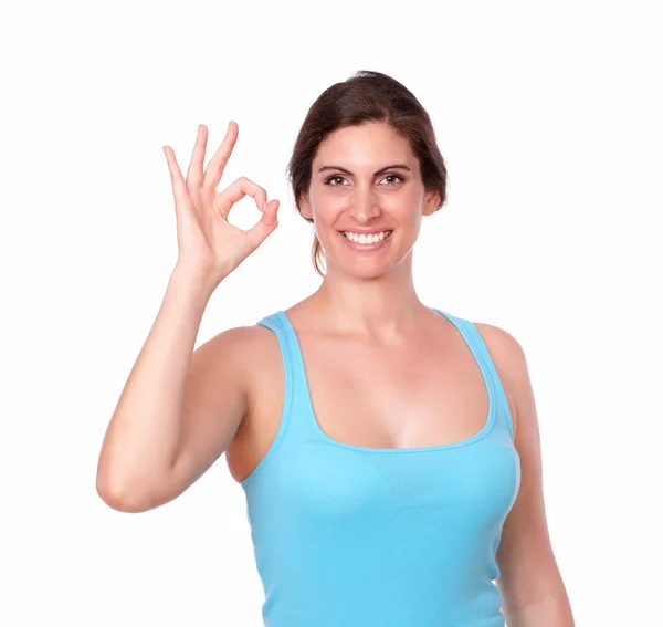 Sporty young woman gesturing ok sign — Stock Photo, Image