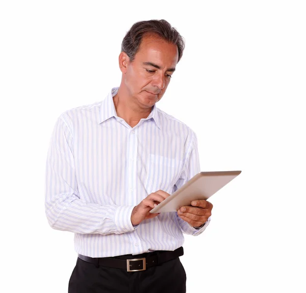 Attractive senior man using his tablet pc — Stock Photo, Image