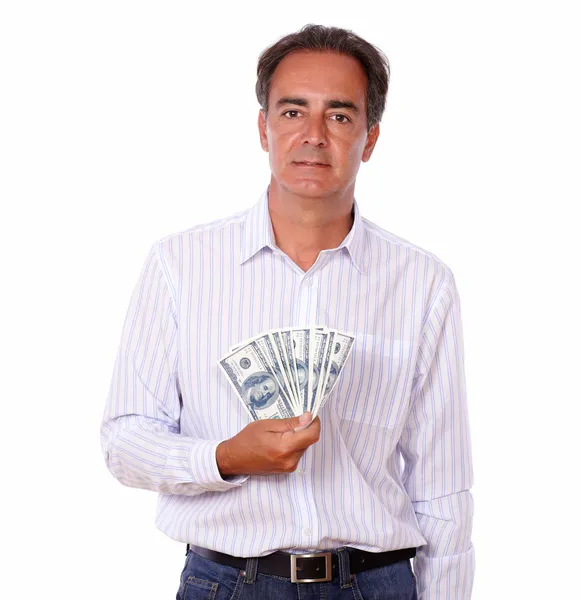 Attraktiv man står och håller dollar — Stockfoto