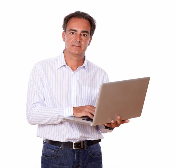 Attractive mature man using his laptop — Stock Photo, Image