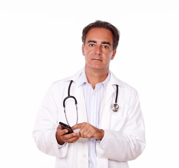 Adult charismatic doctor sending a message — Stock Photo, Image