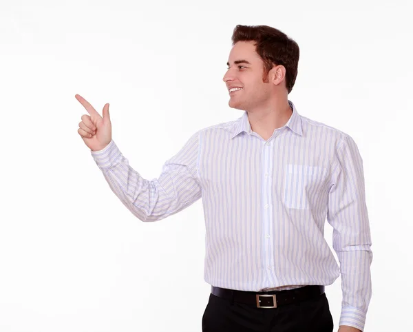 Attractive caucasian man pointing to his right — Stock Photo, Image