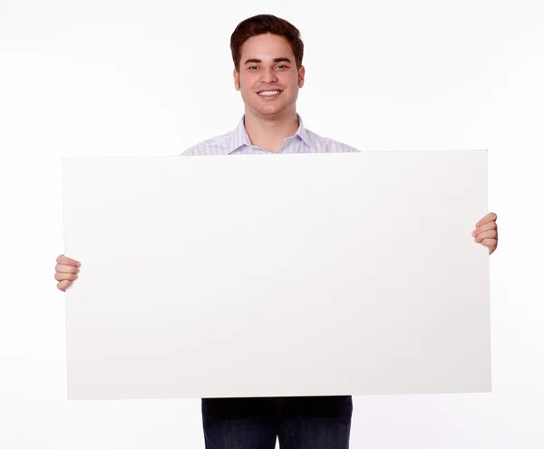 Attractive man holding up a placard — Stock Photo, Image