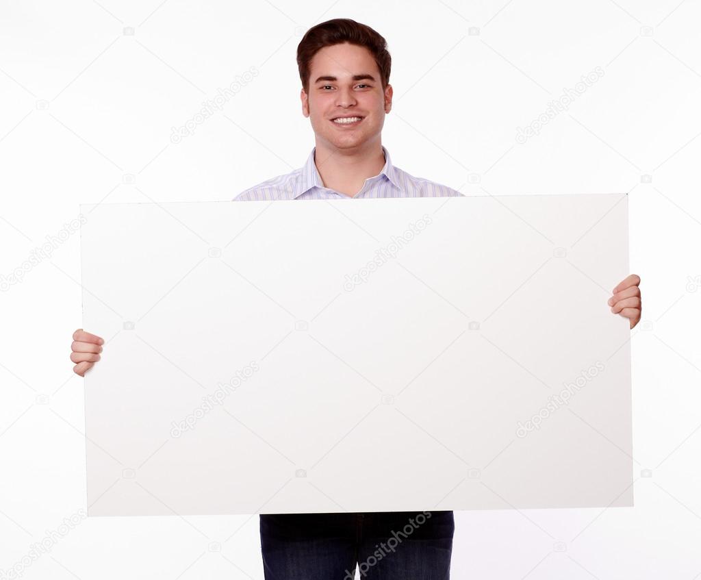 Attractive man holding up a placard