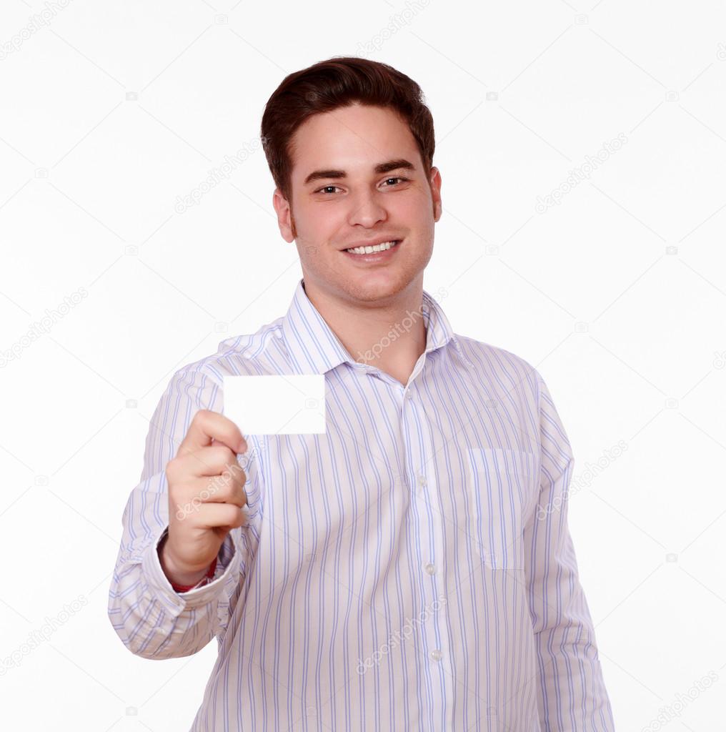 Handsome caucasian man holding blank card