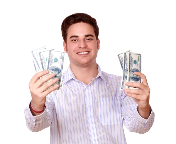 Ładny facet trzyma pieniądze i uśmiechając się — Zdjęcie stockowe