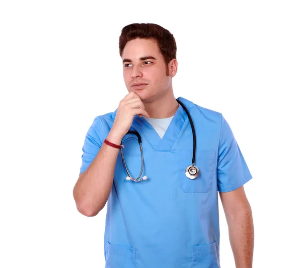 Pensive male nurse looking to his right — Stock Photo, Image