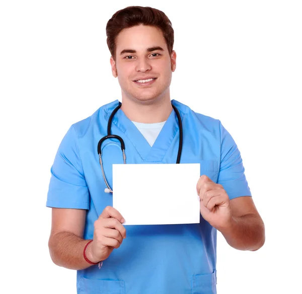 Hombre guapo enfermera sosteniendo una tarjeta en blanco —  Fotos de Stock