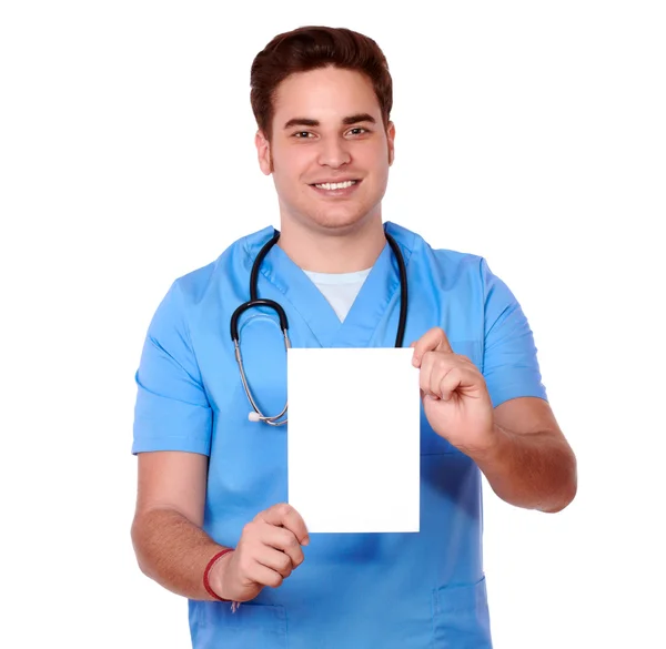 Gorgeous nurse man holding a white card — Stock Photo, Image