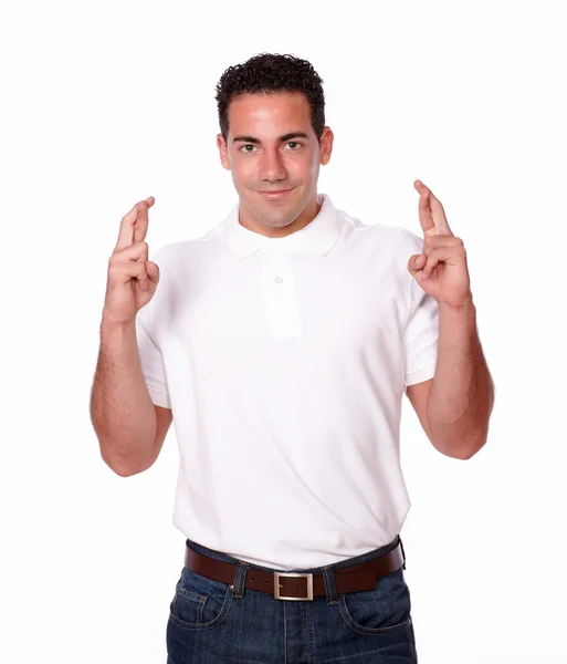 Adult hispanic guy with luck gesture — Stock Photo, Image