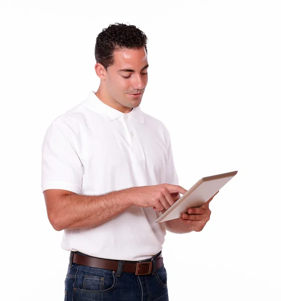 Handsome male looking at his tablet pc — Stock Photo, Image