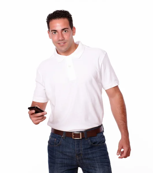 Charismatic man sending a message by cellphone — Stock Photo, Image