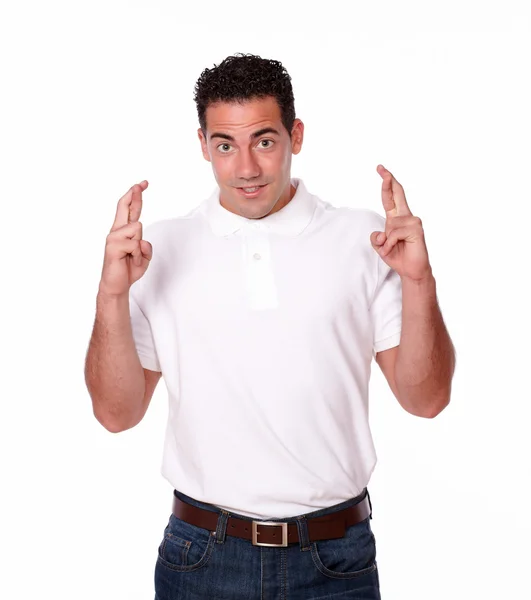 Handsome latin man with luck gesture — Stock Photo, Image