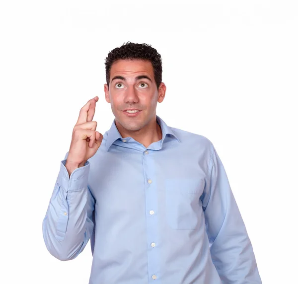 Attractive hispanic male with luck gesture — Stock Photo, Image
