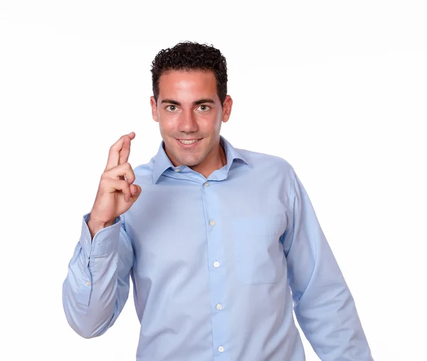 Friendly young man with luck sign — Stock Photo, Image