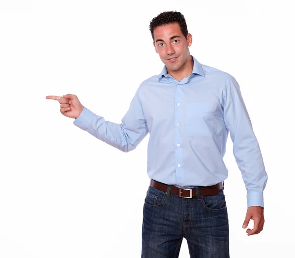 Attractive man pointing to his right — Stock Photo, Image