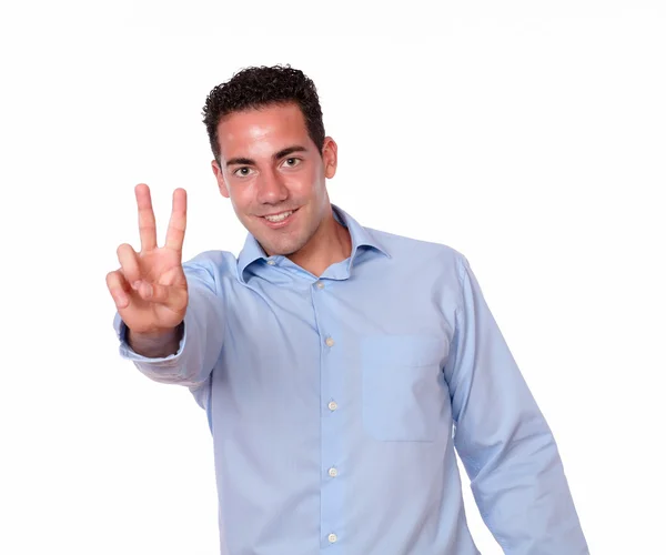 Handsome latin guy with winning sign — Stock Photo, Image