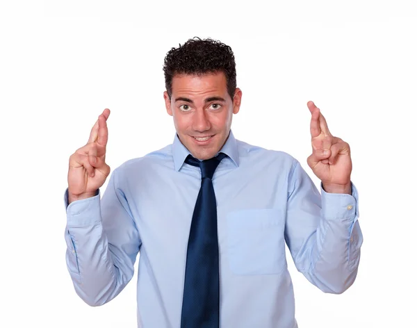 Charming latin male crossing his fingers — Stock Photo, Image