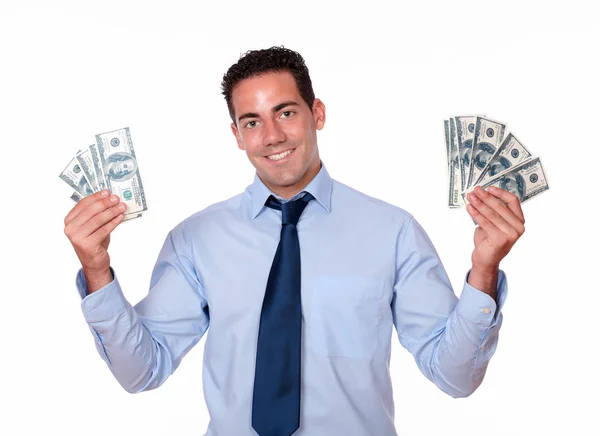 Charismatic male smiling and holding dollars — Stock Photo, Image