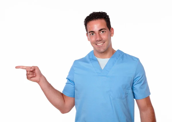 Charismatic latin man pointing to his right — Stock Photo, Image