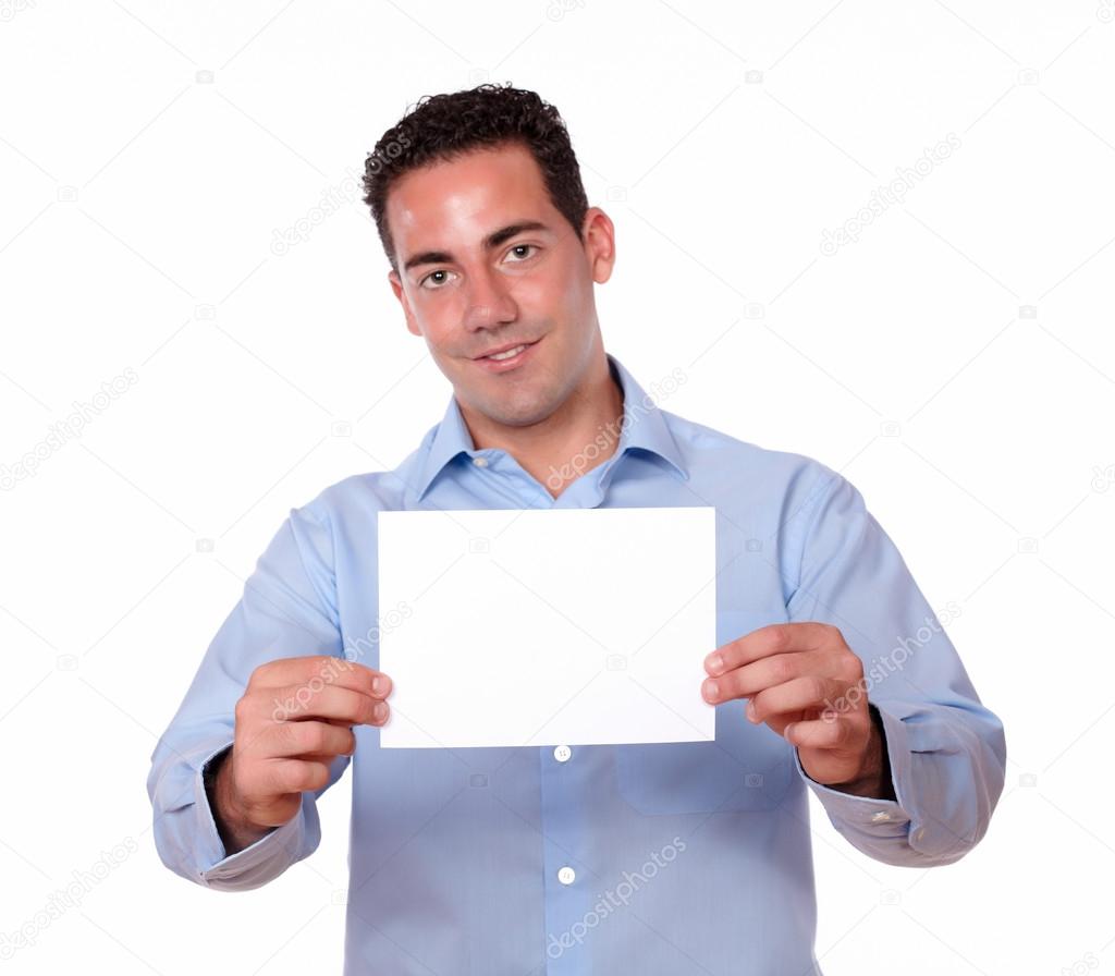 Young guy smiling and holding white card