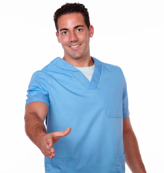 Attractive nurse guy with greeting gesture — Stock Photo, Image
