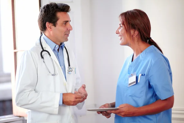 Professional medical group standing and speaking — Stock Photo, Image