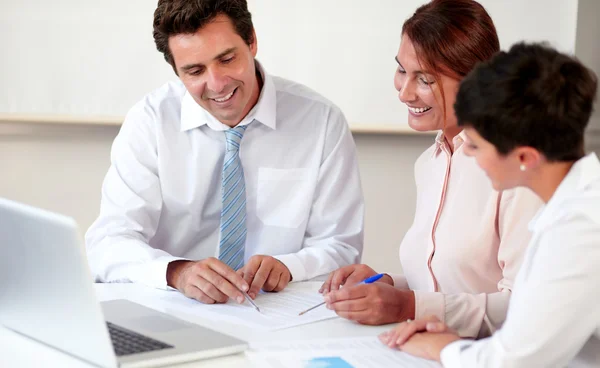 Charming hispanic colleagues working on documents — Stock Photo, Image