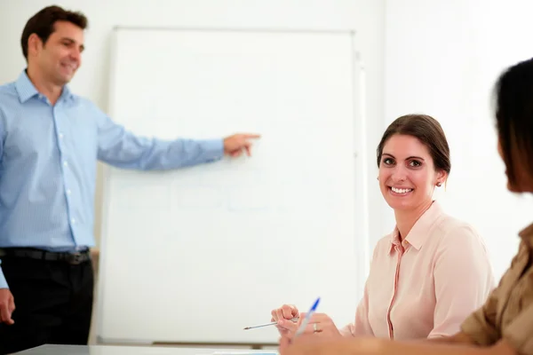 Lovely young businesswoman smiling at you — Stock Photo, Image