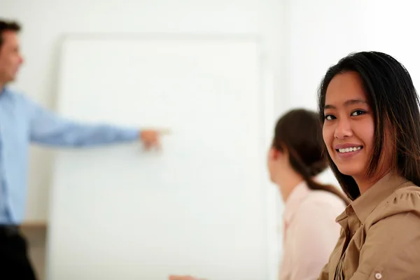 Pretty businesswoman smiling and looking at you — Stock Photo, Image