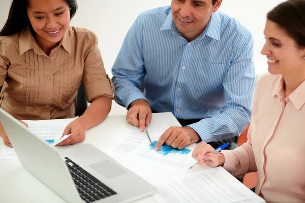 Male and female coworkers working on documents — Stock Photo, Image