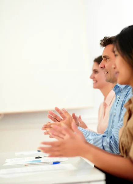 Group of colleagues giving applause during meeting — Stock Photo, Image