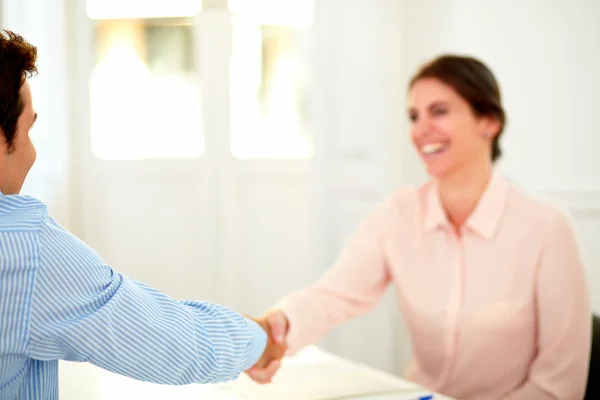 Beautiful businesswoman giving a hand greeting — Stock Photo, Image