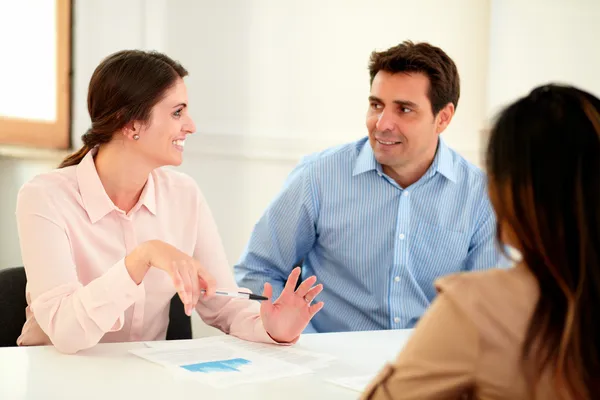 Male and female colleagues smiling each other — Stock Photo, Image
