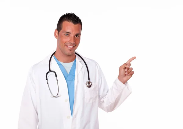 Charming male doctor pointing to his left — Stock Photo, Image