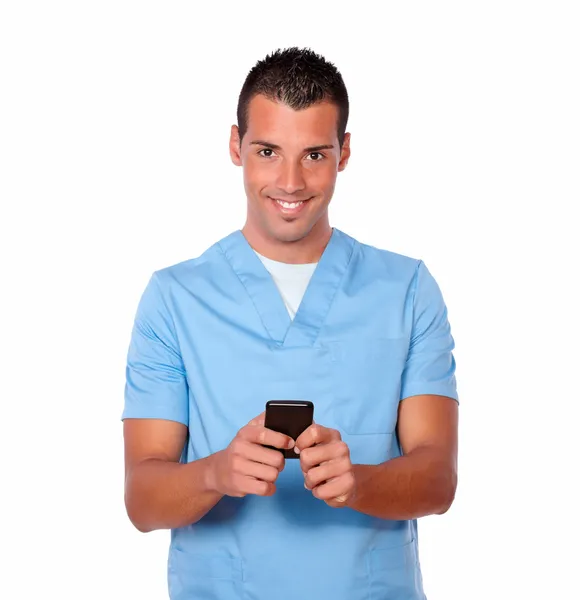 Hübsche Krankenschwester Mann SMS mit seinem Handy — Stockfoto