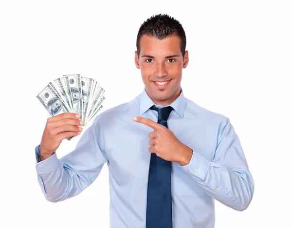 Sjarmerende mann som holder og peker på dollar – stockfoto