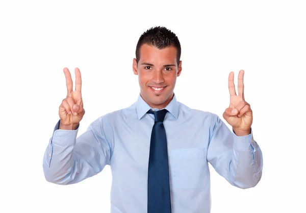 Hombre de negocios guapo con dos signos de victoria —  Fotos de Stock