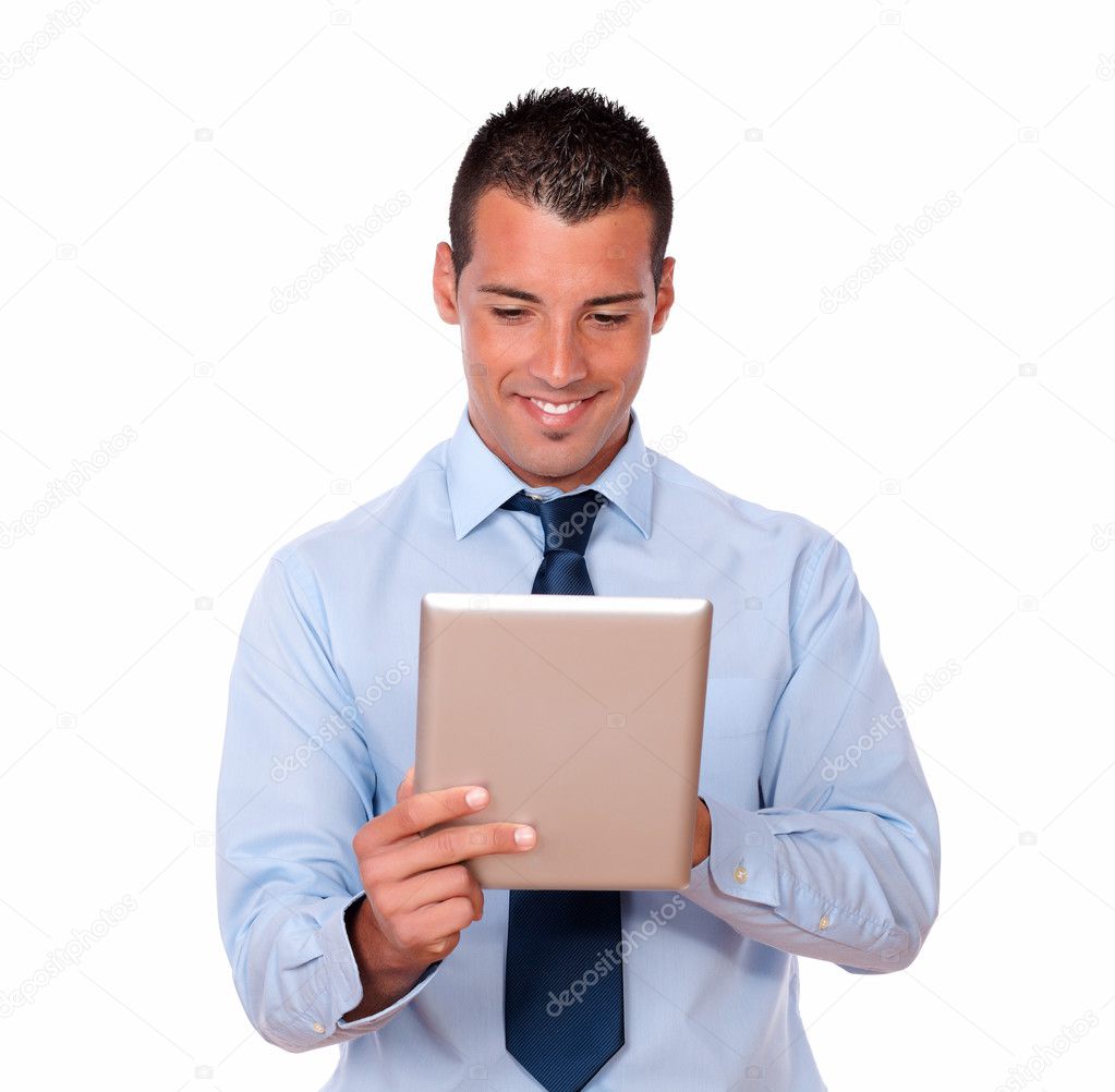 Charismatic latin man using his tablet pc