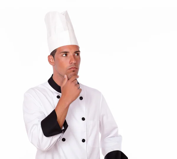 Pensive hispanic chef looking at people — Stock Photo, Image