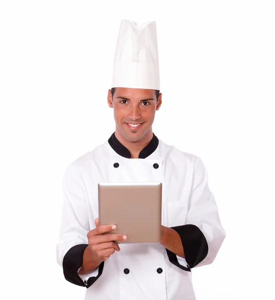 Giovane chef che lavora con il suo tablet pc — Foto Stock