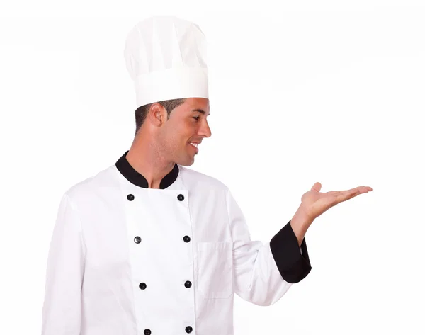 Charmanter Koch hält seine linke Handfläche hoch — Stockfoto
