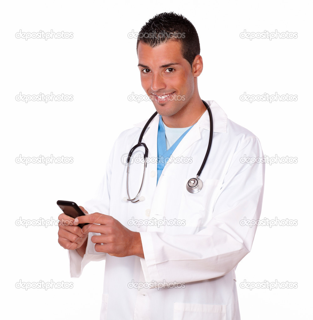 Attractive doctor guy texting a message